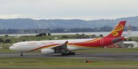 B-8117 @ NZAA - taxying off runway - by magnaman