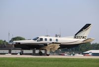 N317WC @ KOSH - Socata TBM 700 - by Mark Pasqualino