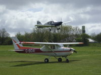 G-BDAI @ EGHP - Taxiing out at Popham airfield with G-AZEV landing behind - by Marc Mansbridge