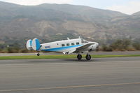 N18E @ SZP - 1958 Beech SUPER E18S, two Pratt & Whitney R985 450 Hp Wasp Jrs., landing roll Rwy 22. Frequent First Sunday visitor from high desert - by Doug Robertson