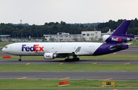 N590FE @ RJAA - Fedex MD11 passing by - by FerryPNL