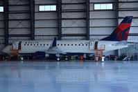 N281SY @ KBOI - In the Skywest Maintenance hangar for final checks. Fresh from the factory in South America. Owned by Skywest Airlines, but flown under Delta colors. - by Gerald Howard
