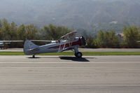 N32135 @ SZP - 1941 Waco UPF-7, Continental W670 220 Hp radial, chromed prop and spinner, one of the prettiest classic biplanes, landing roll Rwy 22 - by Doug Robertson