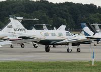 N329KK @ ATW - at a crowded ramp for EAA 18 - by magnaman