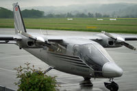 HB-LTQ @ LSZG - On a rainy day at Grenchen airport. - by sparrow9