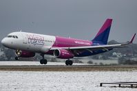 G-WUKB @ EGGW - Wizz Air A320 G-WUKB landing at a snowy London Luton as flight W94490 from Talin TLL - by dave226688