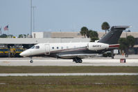 N409FX @ PBI - taxiing at PBI - by Bruce H. Solov