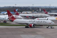 G-VMNK @ EGCC - Under tow at Manchester. - by Graham Reeve