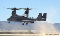 10-0025 @ KABQ - 415th RQS Osprey kickin up some dust - by John Hodges