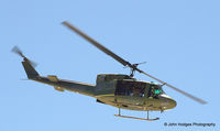 69-6612 @ KABQ - 415th RQS Huey flying out - by John Hodges
