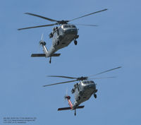 165767 @ USNA - Two Seahawks approaching for landing at Naval Academy. - by J.G. Handelman