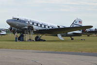 N33611 @ EGSU - (Clipper Tabitha May), 1945 Douglas DC-3C at Duxford receiving some attention to the port engine. - by moxy