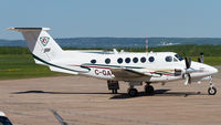 C-GAEW @ CYQM - Parked in front of its hangar right before a departure. - by Tim Lowe