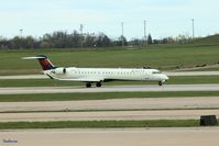N133EV @ KCVG - Bombardier CRJ-900ER    Spotting from the terminal on a late afternoon - by Strabanzer