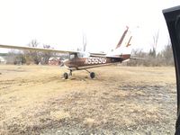 N5569G @ 4B1 - Plane was stuck in the mud, and had just been jacked up on boards, nice flying plane, very muddy spring - by Russell Pokorny
