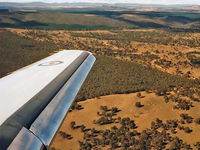 A26-077 @ YSCB - Wing View taken from 34 Squadron VIP Falcon 900 A26-077 Cn 77  on approach to Canberra's Rwy 30, at the end of a 0.4 hour flight from Sydney on 28May1992. This photo was taken approaching 34 Squadron's home base - RAAF Base Fairbairn YSCB. - by Walnaus47