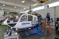 N135WJ @ KJVL - At Helicopter Specialties - by Glenn E. Chatfield