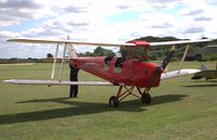 G-APLU @ EGTH - 1941 Tiger Moth being manually lifted and turned for taxiing at the 'Gathering of Moths' Day 2019 at Old Warden - by Chris Holtby