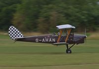 G-AHAN @ EGTH - 1944 Tiger Moth taking off at the Gathering of Moths Day 2019 at Old Warden - by Chris Holtby