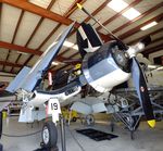 N451FG @ KADS - Vought (Goodyear) FG-1D (F4U) Corsair in the maintenance hangar at the Cavanaugh Flight Museum, Addison TX