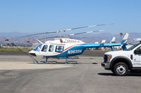 N383SH @ OXR - 1983 BELL 206L-3 LongRanger III, one Allison 250 C30-P 650 SHp Turbo-Shaft, of ASPEN HELICOPTERS. NOTE-There is a second helicopter beyond it, accounting for the extra rotor blades and tails. - by Doug Robertson