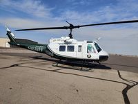 N110SD @ KAVQ - Pinal County Sheriff Department Huey parked at Marana Regional Airport helipad on a cool Saturday morning. - by Ehud Gavron