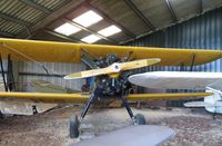 G-BAVO @ EGTN - 1945 Stearman in the hangar at Enstone - by Chris Holtby