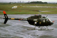 A17-021 @ AYMH - Low res Stbd side view of Australia Army CA-32 / Bell 206B-1 A17-021 (Cn CA32-21 / 44521) hovering in rain near the Mt Hagen AYMH Control Tower in Mar 1975. (ARDU Hot-High Performance Trial.) - by Walnaus47