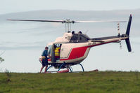 VH-JMN - Rear Port side view of Bell 206B JetRanger II VH-JMN Cn 1353 on a hillside near Cairns befor departing to a pontoon on the Great Barrier Reef QLD on 08Jul2006. The helo is fitted with ‘pop-out floats’ for over-water operations. - by Walnaus47