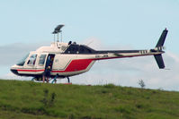 VH-JMN - Port side view of Bell 206B JetRanger II VH-JMN Cn 1353 on a hillside near Cairns before departing to a pontoon on the Great Barrier Reef QLD on 08Jul2006. The helo is fitted with ‘pop-out floats’ for over-water operations. - by Walnaus47