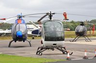 G-TSLC @ EGHH - Bournemouth helis with G-SPKK, G-TSLC and the ill-fated G-WOOW - by John Coates