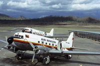 P2-SBD @ AYPY - A couple of Douglas DC-3's at Port Moresby in December 1974 - by Peter Lea