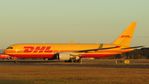 VH-EXZ @ NZAA - Taxiing out to the DHL/Tasman Cargo apron after arrival from Sydney. - by Bipo