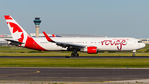 C-FMWU @ CYYZ - Vacating runway 23 with the CYYZ ATC Tower in the background - by Tim Lowe