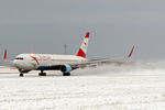 OE-LAY @ LOWW - Departing from a snow-covered runway