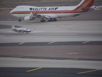 N584JV @ KPHX - 747-400 Departing after the much smaller Pilatus PC-12/45 - by Evan Weinstein