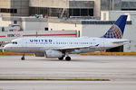 N853UA @ KMIA - Taxiing out for departure - by Robert Kearney