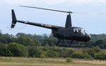 G-JGAR @ EGFH - Visiting Raven II helicopter departing. - by Roger Winser