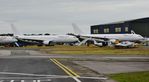 9H-JFS @ EGHH - With 9H-LFS at cargo parking - by John Coates
