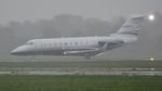 N92FT @ EGHH - Backtracking 26 on arrival in pouring rain - by John Coates