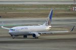 N27205 @ KLAX - United Boeing 737-824, N27205 taxiing to 25R LAX - by Mark Kalfas