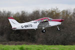 G-BNTD @ EGFH - Resident Warrior II aircraft departing Runway 04. Note new colour scheme. - by Roger Winser