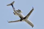 N947SW @ KORD - SkyWest/United Express CRJ2 N947SW operating as SKW5704 from MLI to ORD, on approach to 10L KORD - by Mark Kalfas