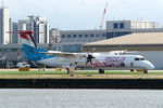 LX-LQJ @ EGLC - Seen at London City Airport, with Think Pink logo on the side of the aircraft. - by Graham Reeve