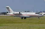 N319JE @ KPBI - Vistajet CL605 taxying past after arrival - by FerryPNL