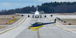 N868JB @ KPSM - Utility Line helo heads off after filling up while an Atlas 747 comes down the Alpha Taxiway