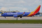 N8801Q @ KMIA - Southwest B738M taxying past - by FerryPNL