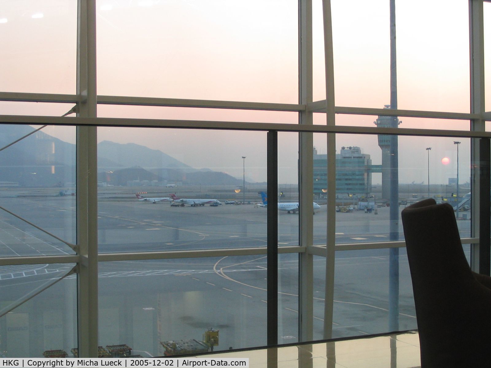 Hong Kong International Airport, Hong Kong Hong Kong (HKG) - Beautiful sunset at Chep Lap Kok. View from the UA Red Carpet Club onto the apron and runway