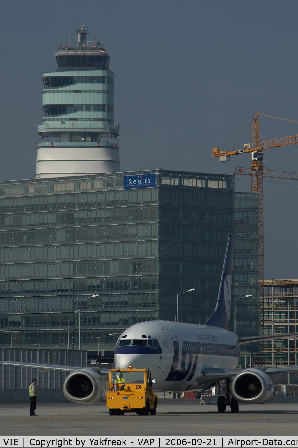 Vienna International Airport, Vienna Austria (VIE) - LOT Boeing 737 pushing back infront of the office park and the control tower