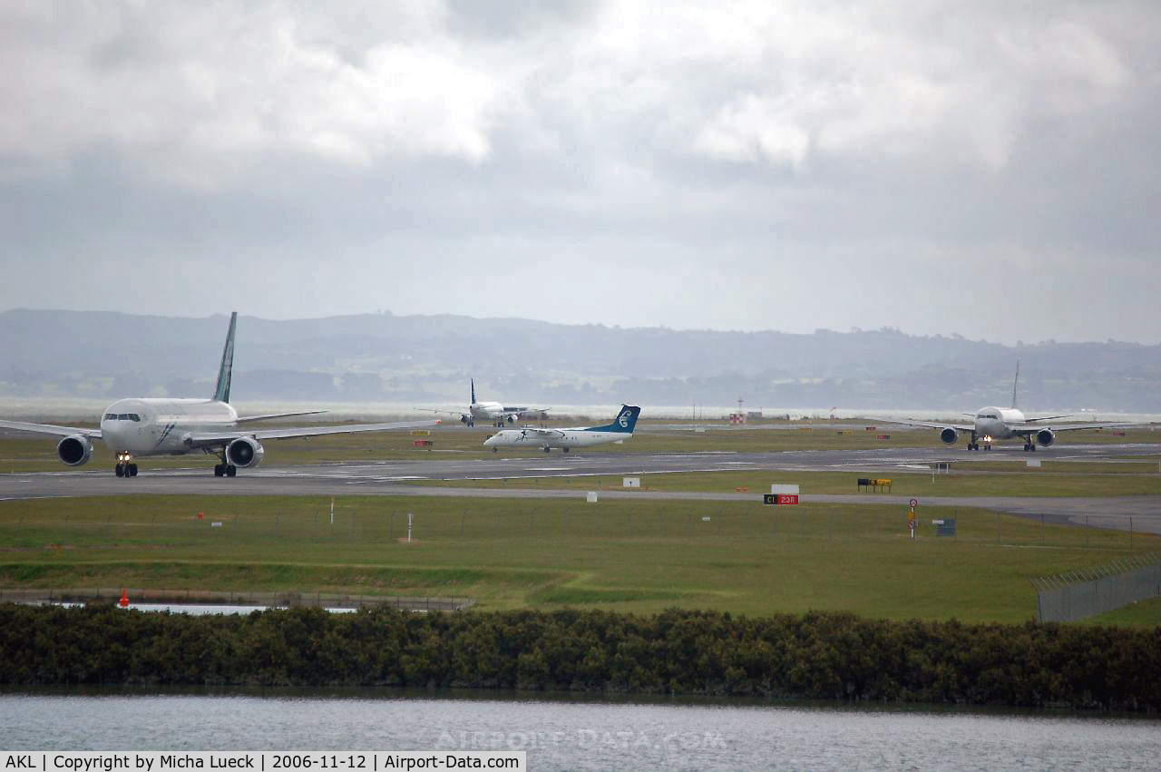 Auckland International Airport, Auckland New Zealand (AKL) - A 320-200, two B 767-300, and a DHC 8 - all of Air NZ - at home